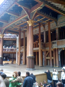 The stage at the Globe, as some 'groundlings' are going right up to the edge.